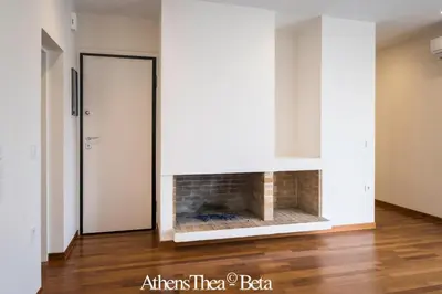 a living room with a fireplace in the wall at AthensThea Luxury Penthouse Apt in Omonia 115sq.m. in Athens