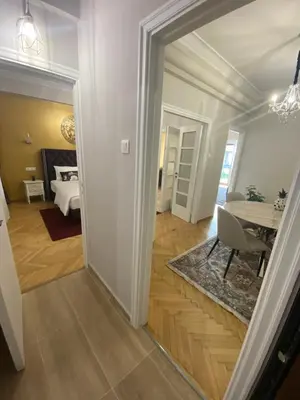 a hallway with a dining room and a room with a table at Check Point - Acropolis View B in Athens