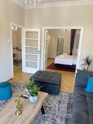 a living room with a couch and a bed at Check Point - Acropolis View B in Athens