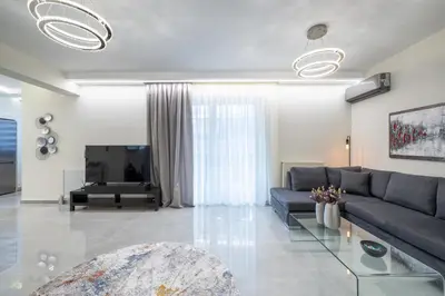 a living room with a couch and a table at Acropolis Cozy Apartments in Athens