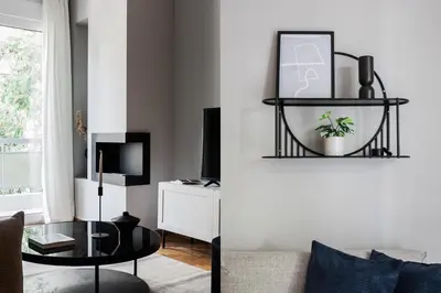 a living room with a table and a couch at Stunning 2BR Apartment in Lycabettus by UPSTREET in Athens