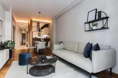a living room with a couch and a table at Stunning 2BR Apartment in Lycabettus by UPSTREET in Athens