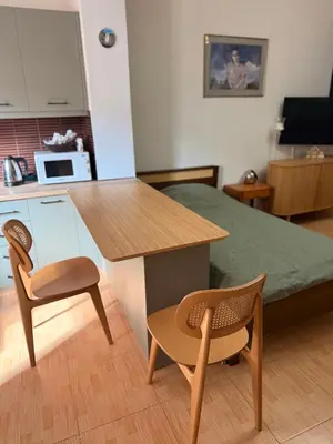 a room with a table and two chairs and a bed at Athens Room in Athens