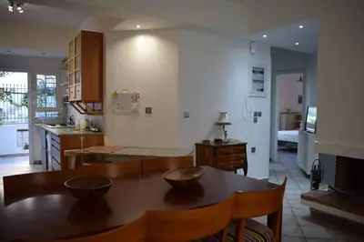 a kitchen with a table with bowls on it at h2h Dafni #Family home near Athens, airport, ports with garden in Athens