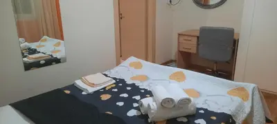 a bedroom with a bed and a desk and a mirror at Livia's Room To Ampelokipi metro Airport line in Athens