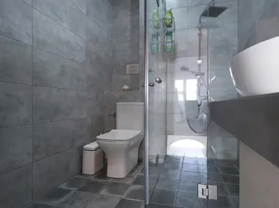 a bathroom with a shower and a toilet and a sink at Beautiful Athenian apartment next to the center in Athens