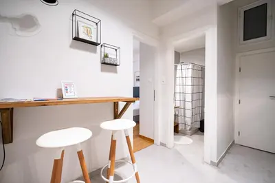 a room with two stools and a table in a room at Athens-center 1 bedroom 2 persons apt by MPS in Athens