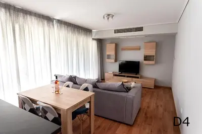 a living room with a couch and a table at Sea view apartments in Alimos region in Athens
