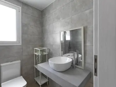 a bathroom with a sink and a toilet at Beautiful Athenian apartment with terrace in Athens