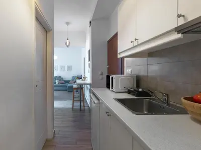 a kitchen with a sink and a counter top at Beautiful Athenian apartment with terrace in Athens