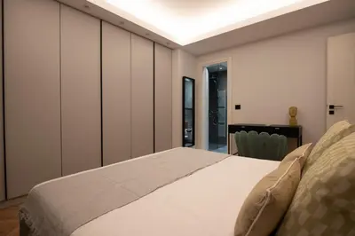 a bedroom with a large white bed in it at Phaedrus Living Luxury Penthouse Ploutarchou in Athens