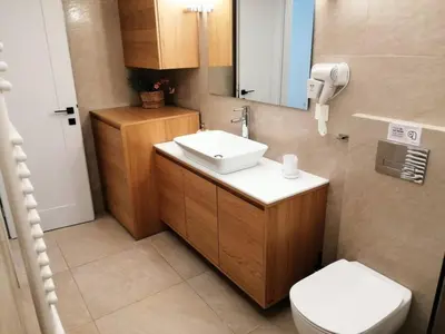 a bathroom with a sink and a toilet at Elegant apartment in Acropolis in Athens
