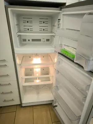 an empty refrigerator with its door open and its door at Group & family penthouse 300m from Agios Ioannis subway,metro station! in Athens