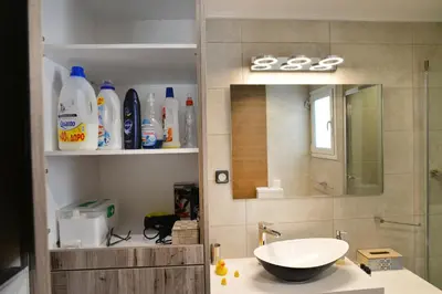 a bathroom with a sink and a mirror at Colorful Apt. Near Nea Smirni Square in Athens