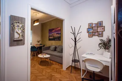 a living room with a couch and a table at Blue Ark Acropolis Spirit in Athens