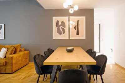 a dining room with a wooden table and chairs at Elegant Big Apartment in Athens Center With Balcony in Athens
