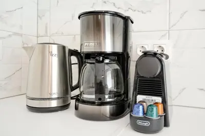 a coffeemaker and a coffee maker on a counter at Elegant Big Apartment in Athens Center With Balcony in Athens