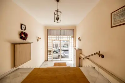 a hallway with a stairway leading to a door at Cozy apartment in Kolonaki Athens - Sleeps 5 in Athens