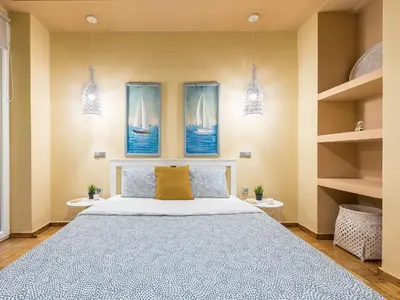 a bedroom with a bed and three paintings on the wall at Rest Sleep Repeat by museum-1 in Athens