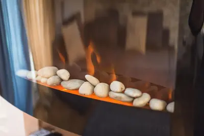 a row of rocks on a shelf in an oven at Rest Sleep Repeat by museum-1 in Athens