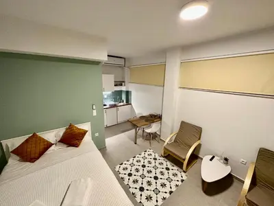 a bedroom with a bed and a table and a chair at A13 Athens in Athens