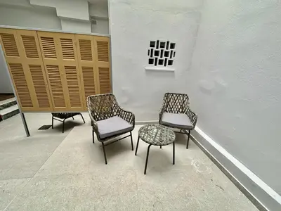 three chairs and a table in a room at A13 Athens in Athens
