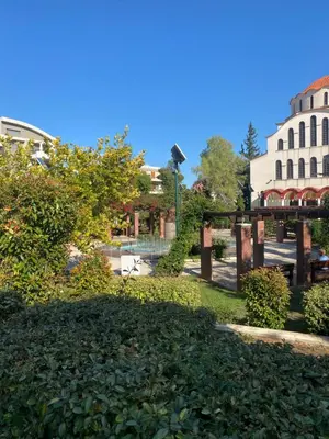 a park in the middle of a city at Traditional And Spacious Apartment In Neo Psychiko in Athens