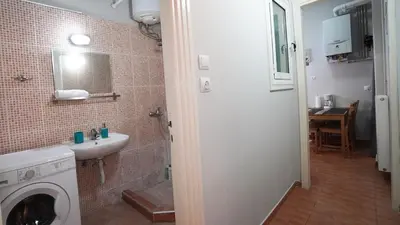 a bathroom with a sink and a washing machine at Athens City Themis13 in Athens