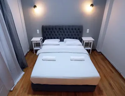 a bedroom with two beds and two tables at Athens City Themis13 in Athens