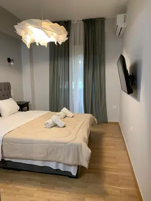 a bedroom with a bed with two towels on it at Athens City Themis 6 in Athens