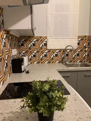 a kitchen with a vase with a plant on a counter at Athens City Themis 6 in Athens