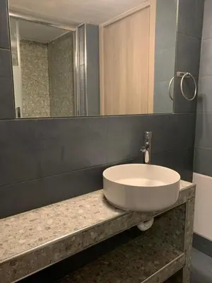 a bathroom with a sink and a mirror at Athens City Themis 6 in Athens