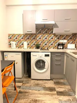 a kitchen with a washing machine in a kitchen at Athens City Themis 6 in Athens