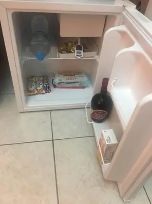 an open refrigerator with food and drinks in it at Central Mini & full renovated Studio @ Syntagma in Athens