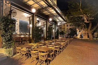 a row of tables and chairs outside of a restaurant at Central Mini & full renovated Studio @ Syntagma in Athens