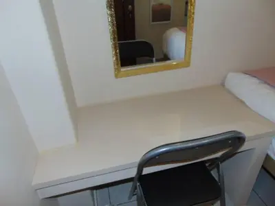 a white desk with a mirror and a chair at Central Mini & full renovated Studio @ Syntagma in Athens