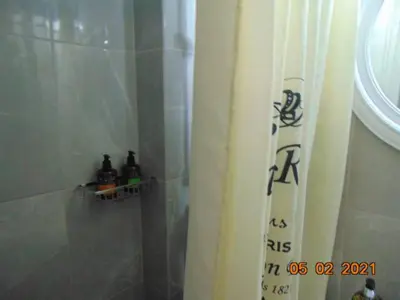 a bathroom with a shower curtain and a sink at Central Mini & full renovated Studio @ Syntagma in Athens