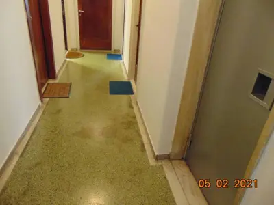 an empty hallway with a long hallway with a hallway at Central Mini & full renovated Studio @ Syntagma in Athens