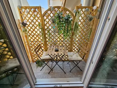 an overhead view of a patio with a table and chairs at Acropolis Museum Suite by YHA in Athens