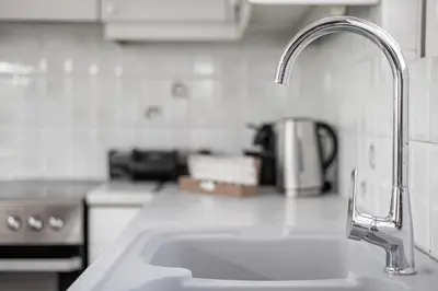 a kitchen counter with a sink in a kitchen at Blue Riviera villas & suites - Alimos 2 in Athens