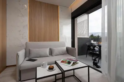 a living room with a couch and a table at Incanto Boutique Suites - Mets in Athens