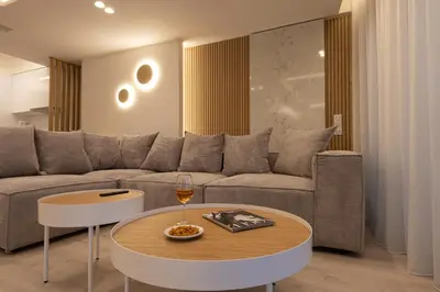 a living room with a couch and a table at Incanto Boutique Suites - Mets in Athens