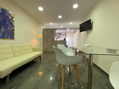 a living room with a couch and a table at Ermou Studio in Athens