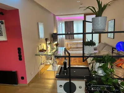 a living room with a glass table and potted plants at Zen home in Athens