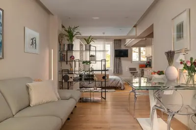 a living room with a couch and a table at Zen home in Athens