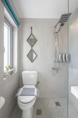 a bathroom with a toilet and a shower at Acropolis View Mini Sky Suite & Hot Tub in Athens