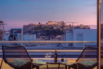 a view ofhens from a restaurant with a table and chairs at Acropolis View Mini Sky Suite & Hot Tub in Athens