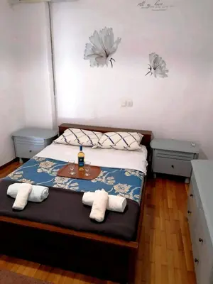 a bedroom with a bed with towels on it at Kalamaki Guest House in Athens