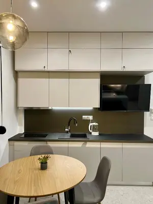 a kitchen with a wooden table and a sink at Smart Lux Apartment B in Athens