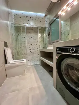 a laundry room with a washer and dryer in it at Smart Lux Apartment B in Athens